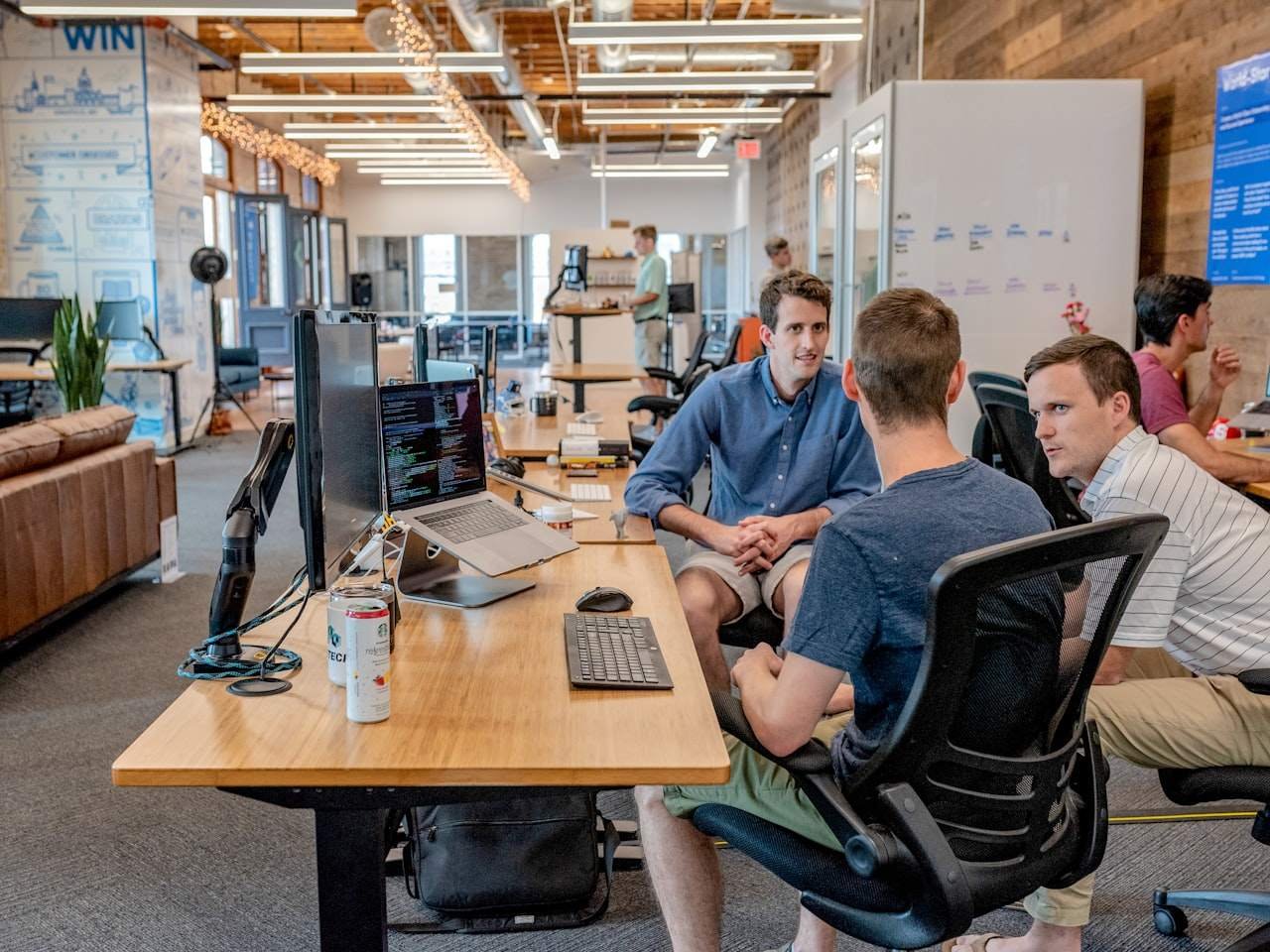 Support team helping customers in an office